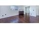 Bedroom featuring hardwood floors and a dresser with decor lamps on top at 14120 E Warren Pl, Aurora, CO 80014