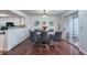 Open dining room with hardwood floors, sliding glass doors, and stylish decor, perfect for entertaining guests at 14120 E Warren Pl, Aurora, CO 80014