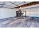 Spacious garage with ample storage, including shelving, bicycles and an extra refrigerator at 14120 E Warren Pl, Aurora, CO 80014