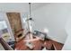 Bright living room with a brick fireplace, wood floors, high ceilings and a ceiling fan at 14120 E Warren Pl, Aurora, CO 80014