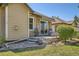Charming back patio with stone pavers, awning, and comfortable outdoor seating perfect for relaxing at 6114 Salvia Ln, Arvada, CO 80403