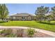 Well-manicured backyard with vibrant green grass, mature trees, and thoughtfully designed landscaping at 6114 Salvia Ln, Arvada, CO 80403
