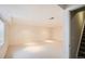 Spacious basement with neutral carpet, bright lighting, and white walls at 6114 Salvia Ln, Arvada, CO 80403