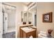 Bright bathroom with a mirror, towels, and a sink at 6114 Salvia Ln, Arvada, CO 80403