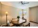 Charming dining area with a quaint table, neutral walls, and bright windows at 6114 Salvia Ln, Arvada, CO 80403
