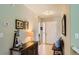 Inviting entryway featuring tile flooring, decorative furnishings, and a well-lit interior at 6114 Salvia Ln, Arvada, CO 80403