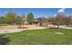 Community playground featuring modern play equipment and a safe, open space for children at 6114 Salvia Ln, Arvada, CO 80403
