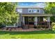A well-maintained backyard featuring a covered deck and lush lawn creates a private outdoor retreat at 11930 E Lake Cir, Greenwood Village, CO 80111