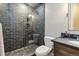 Modern bathroom features a glass-enclosed shower with sleek tile and a stone sink at 11930 E Lake Cir, Greenwood Village, CO 80111