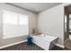 Bright bathroom with a freestanding tub, stylish tile flooring, and a stool by the window at 11930 E Lake Cir, Greenwood Village, CO 80111