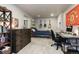 Comfortable bedroom with a desk, guitars on wall, a dark wood dresser and study area at 11930 E Lake Cir, Greenwood Village, CO 80111