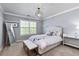 Serene bedroom with a comfortable bed, ample natural light, and stylish decor for a relaxing retreat at 11930 E Lake Cir, Greenwood Village, CO 80111