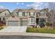 Beautiful two-story brick home featuring a three-car garage and well-maintained landscaping at 11930 E Lake Cir, Greenwood Village, CO 80111