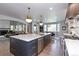 Spacious kitchen with a large island, modern appliances, and open layout to the living spaces at 11930 E Lake Cir, Greenwood Village, CO 80111