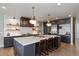 Well-appointed kitchen with an oversized island, stainless steel appliances, and custom cabinetry at 11930 E Lake Cir, Greenwood Village, CO 80111