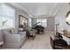 Cozy living room features bright windows, tray ceiling, comfortable seating, and a grand piano at 11930 E Lake Cir, Greenwood Village, CO 80111