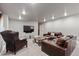 Cozy living room features leather seating, stylish coffee table, and recessed lighting at 11930 E Lake Cir, Greenwood Village, CO 80111