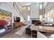 Bright living room boasts soaring ceilings, fireplace, and a stylish staircase at 11930 E Lake Cir, Greenwood Village, CO 80111