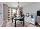 Stylish home office with unique light fixture and zebra-print rug at 11930 E Lake Cir, Greenwood Village, CO 80111