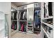 Well-organized walk-in closet with custom shelving, hanging rods, and storage for clothes and accessories at 11930 E Lake Cir, Greenwood Village, CO 80111
