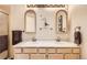 Bathroom featuring double sinks, spacious countertop, and neutral finishes at 1773 S Union Blvd, Lakewood, CO 80228