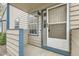 Inviting front entryway with a storm door, window, and traditional siding at 1773 S Union Blvd, Lakewood, CO 80228