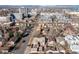 Aerial view of homes in a suburban neighborhood, showcasing its proximity to the downtown area, offering a convenient location at 1556 Osceola St, Denver, CO 80204