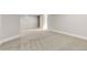 Spacious basement features neutral carpet, trim, and paint, ready for customization at 1556 Osceola St, Denver, CO 80204