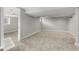 Finished basement area with plush carpet, recessed lights, and access to other rooms at 1556 Osceola St, Denver, CO 80204