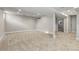 Finished basement with carpet, recessed lighting, and white trim at 1556 Osceola St, Denver, CO 80204