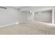 A finished basement area with plush carpet and recessed lighting at 1556 Osceola St, Denver, CO 80204