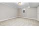 Finished basement bedroom with plush neutral carpeting, a window, and fresh paint at 1556 Osceola St, Denver, CO 80204