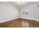 A bright bedroom featuring hardwood floors and double windows for plenty of natural light at 1556 Osceola St, Denver, CO 80204