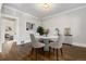 Elegant dining room with marble table, hardwood floors, and stylish decor at 1556 Osceola St, Denver, CO 80204