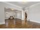 Spacious living room featuring hardwood floors, a decorative fireplace, and neutral wall color at 1556 Osceola St, Denver, CO 80204