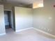 Cozy bedroom featuring neutral walls and carpet, leading to an adjacent bathroom at 5401 S Park Terrace Ave # 204C, Greenwood Village, CO 80111