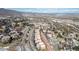 Scenic aerial view of a residential community nestled among the foothills with winding roads and mountain views at 10576 Roxborough Dr, Littleton, CO 80125