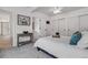 Bright bedroom with soft carpet, white walls, and a sliding door closet at 10576 Roxborough Dr, Littleton, CO 80125