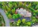 Aerial view of home and surrounding trees and greenery at 120 Windwood Cir, Breckenridge, CO 80424