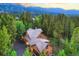 Aerial view of cabin home nestled in the Colorado mountains at 120 Windwood Cir, Breckenridge, CO 80424