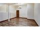 Finished basement with wood-look flooring and support columns at 120 Windwood Cir, Breckenridge, CO 80424
