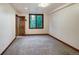 Bedroom featuring carpet floors, natural light and wood door at 120 Windwood Cir, Breckenridge, CO 80424