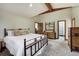 Spacious bedroom featuring vaulted ceilings with wood beam and walk-in closet at 120 Windwood Cir, Breckenridge, CO 80424