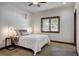 Cozy bedroom with a plush carpet, comfortable bed, and natural light from the window at 120 Windwood Cir, Breckenridge, CO 80424
