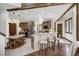 Spacious kitchen with wood cabinets, white countertops, a breakfast bar, and stainless steel appliances at 120 Windwood Cir, Breckenridge, CO 80424
