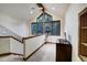 Spacious loft area with large windows, a telescope, and a comfortable seating area at 120 Windwood Cir, Breckenridge, CO 80424