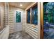 Enclosed porch featuring a stone tile floor and access to an outdoor deck with seating at 120 Windwood Cir, Breckenridge, CO 80424