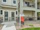 Townhome entryway with for sale sign and walkway at 11250 Florence St # 28E, Commerce City, CO 80640