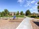 Community playground with swings and play area at 11250 Florence St # 28E, Commerce City, CO 80640