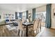 Bright dining area with a table and chairs, and hardwood floors at 7548 E 159Th Pl, Thornton, CO 80602